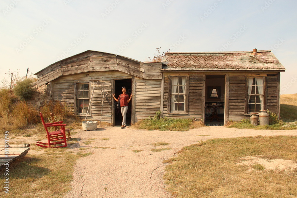 A woman in the door of Prairie Homestead, South Dakota