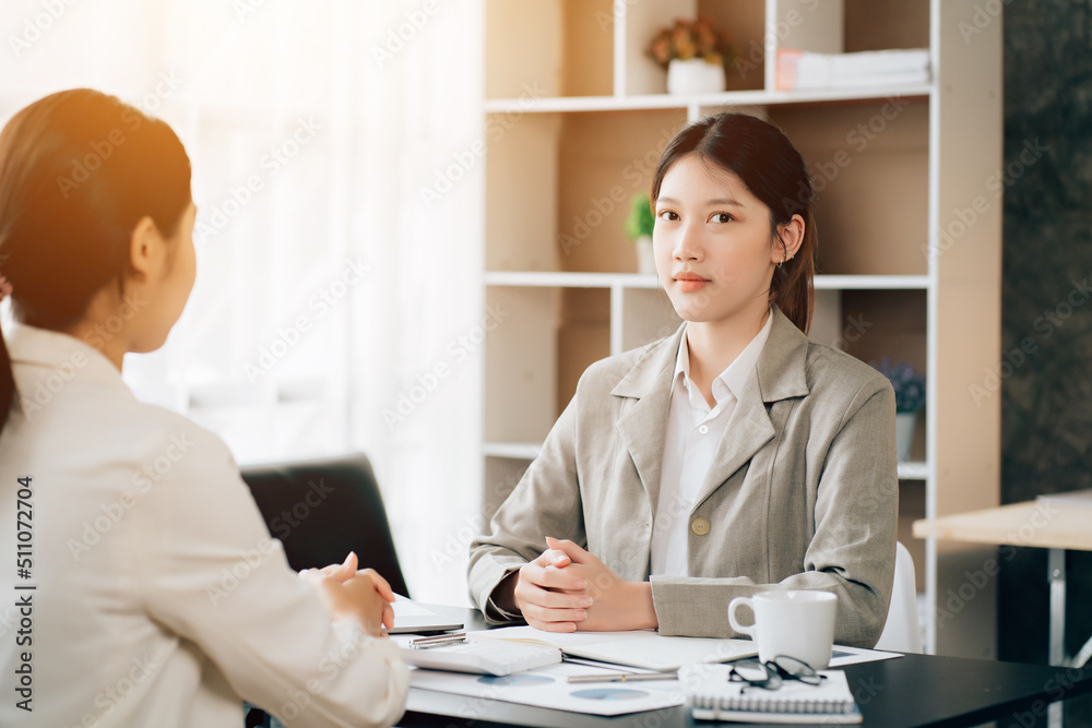 Business women using calculator at working with financial report. Business women using calculator at working with financial report.