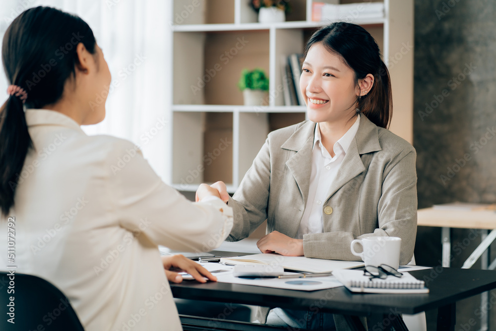 Business women using calculator at working with financial report. Business women using calculator at working with financial report.