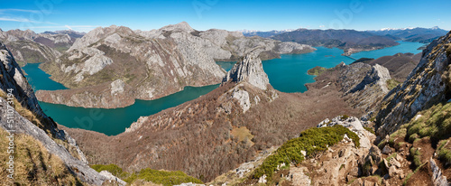 Beautiful turquoise waters reservoir and mountain landscape in Riano. Spain photo