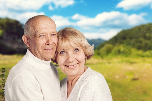 Perfect happy senior couple going for a walk in the park. © BillionPhotos.com