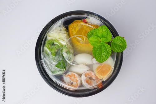 Food rice noodles with crab curry sauce on white background.