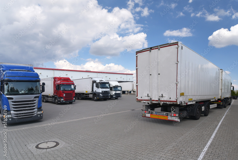 Trucks loading at a depot of a forwarding agency - Transport and logistics in goods trade