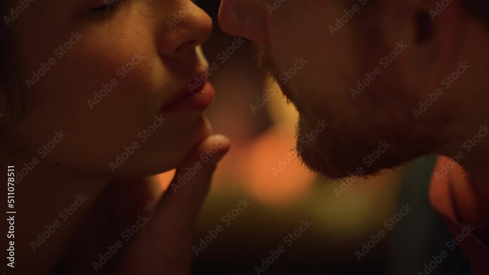 Closeup sexy lovers face enjoy love by fire. Sensual couple flirt on date