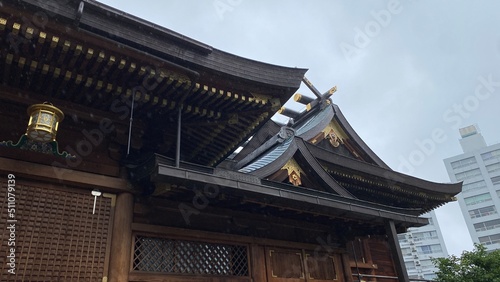 The main pagoda of Yushima Tenjin, the historic establishment in 458 the beautiful architecture with plum symbolic family crest “Kamon”. Photo taken year 2022 June 15th