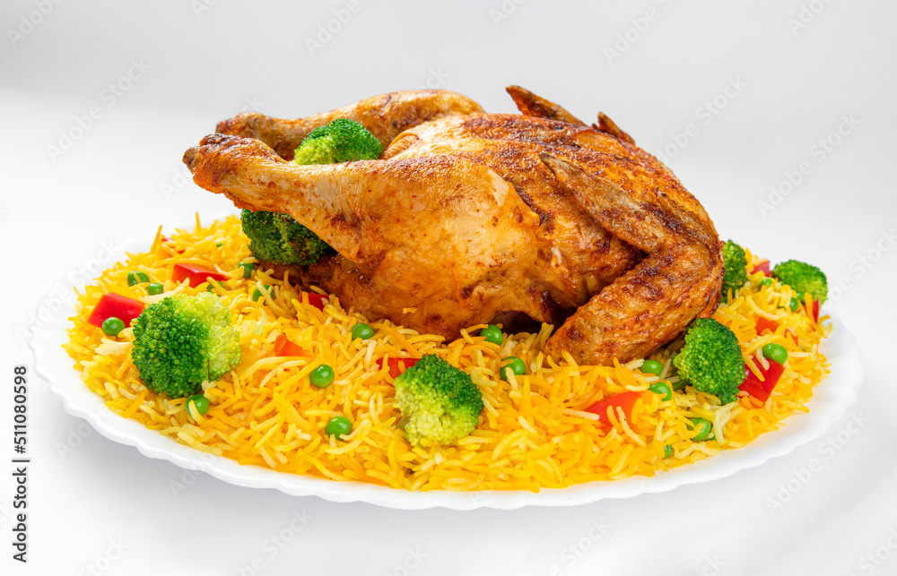 Full Chargha (Whole Grilled Chicken) with Vegetables and Saffron Rice. Extremely Delicious and Spicy Food. This food also called Mandee in Arab Countries. Full Chargha (Whole Grilled Chicken) with Vegetables and Saffron Rice. Extremely Delicious and Spicy Food. This food also called Mandee in Arab Countries.