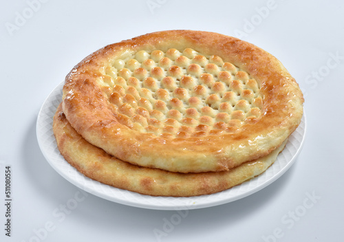 Lahori Kulcha, is a unique shape of flatbread. Popular in Lahore, Pakistan but also popular in many countries. Prepared with finest wheat flour and then coat with butter. photo