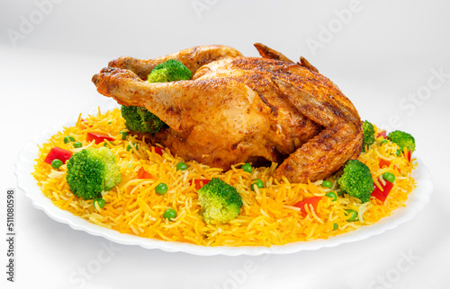 Full Chargha (Whole Grilled Chicken) with Vegetables and Saffron Rice. Extremely Delicious and Spicy Food. This food also called Mandee in Arab Countries. photo