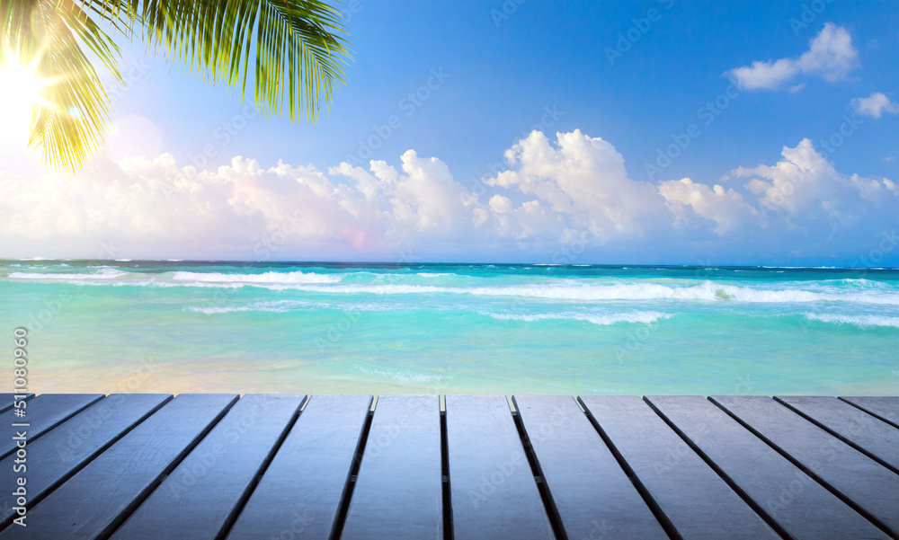 Fototapeta premium Art beautiful summer tropical holiday background; suny sandy beach, palm tree and wooden deck