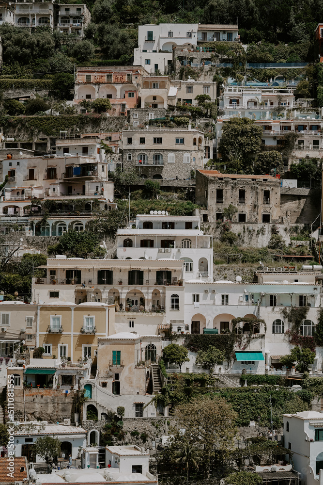 Panoramic views of Positano in the Amalfi Coast in Italy. The view of Positano town, colorful buildings, roads, boats and the sea.
