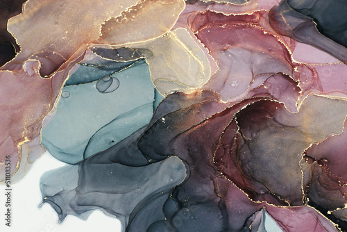 Abstract fluid ink painting background in black colors with golden splashes.