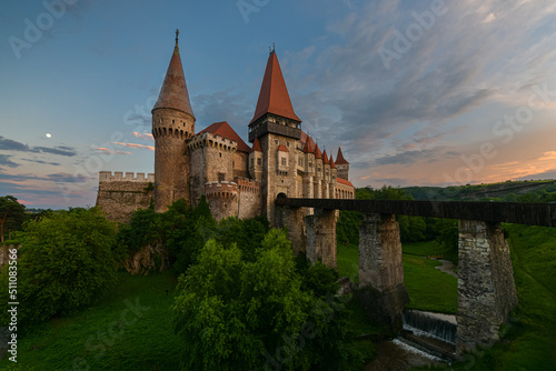 Beautiful summer sunset at Corvin (Hunyad) Castle in Hunedoara, an amazing landmark from Transylvania, one of the biggest castles in Europe. Travel to Romania.