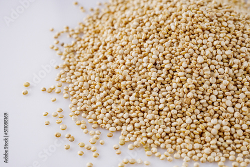 white quinoa seeds on a white acrylic background