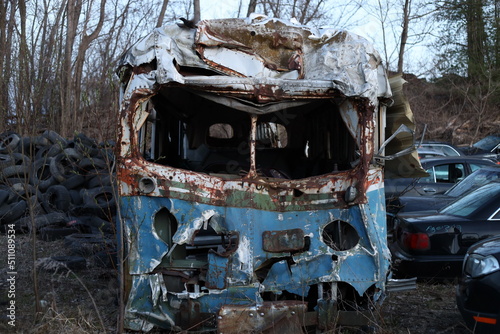 old decaying and eroded bus in the junkyard
