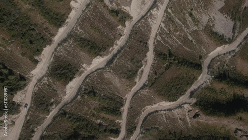 Danger Katu Yaryk Pass with traffic cars in Chulyshman valley in Altai, Siberia, Russia. Beautiful summer nature landscape at during daytime. Aerial view from a drone photo