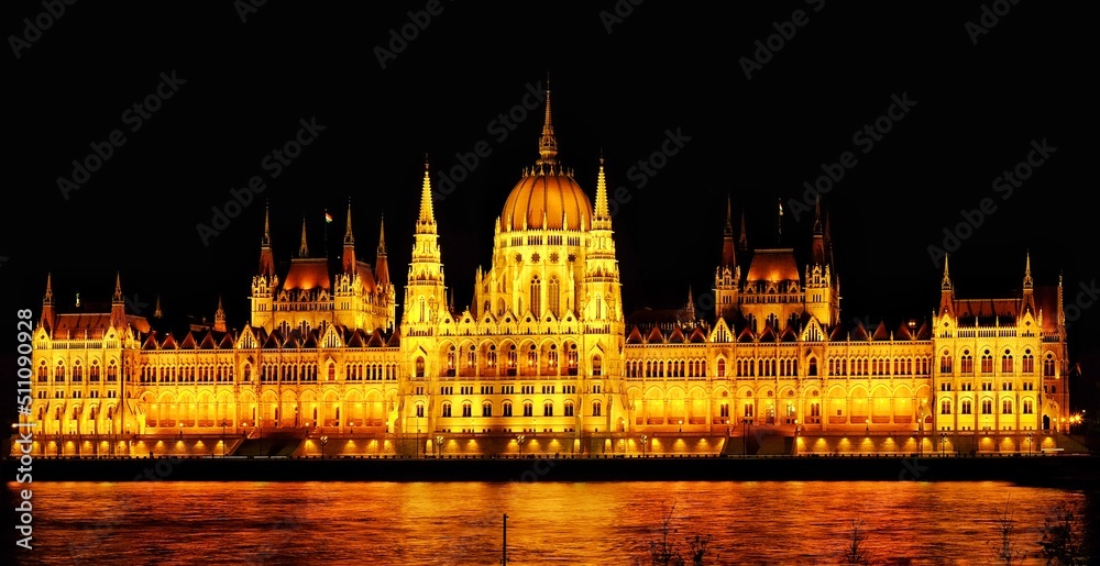Golden light Hungarian parliament at night in Budapest, Hungary
