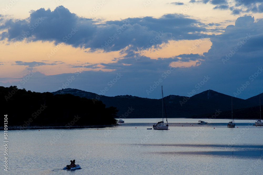 sunset cloudscape in the bay of village Brgulje on island Molat in Croatia