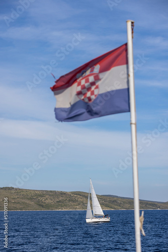 Obraz na płótnie croatian flag and sailboat in the mediterranean sea w salonie