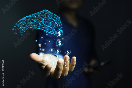 A man's hand receives a coin from a digital hand. low poly is money from transactions via smartphones or from trading through the application system. Accessing money with technology concepts. photo