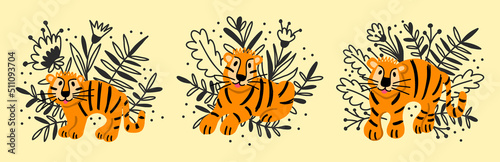 A set with cartoon funny tigers and flowers in a children's style