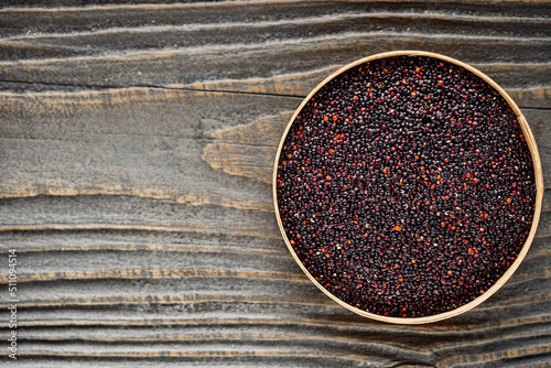 black quinoa seeds on a dark rustic background