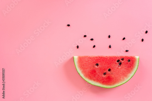 sliced watermelon on pink background.