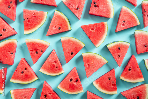 sliced watermelon on green background.