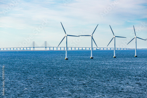 Obraz na płótnie The Middelgrunden offshore wind farm in the Øresund near Copenhagen, Denmark - Øresund Bridge between Copenhagen and Malmo, Sweden is in the background w salonie