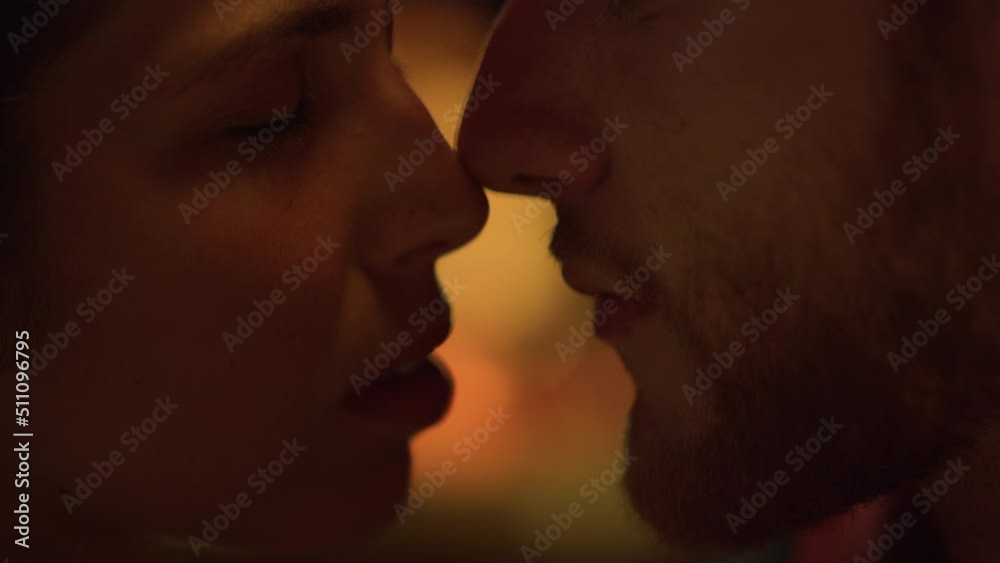 Closeup sensual couple faces on romantic honeymoon. Two lovers enjoy love. Closeup sensual couple faces on romantic honeymoon. Two lovers enjoy love.