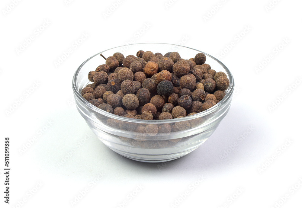 allspice (pimento) in a glass bowl isolated on white background allspice (pimento) in a glass bowl isolated on white background