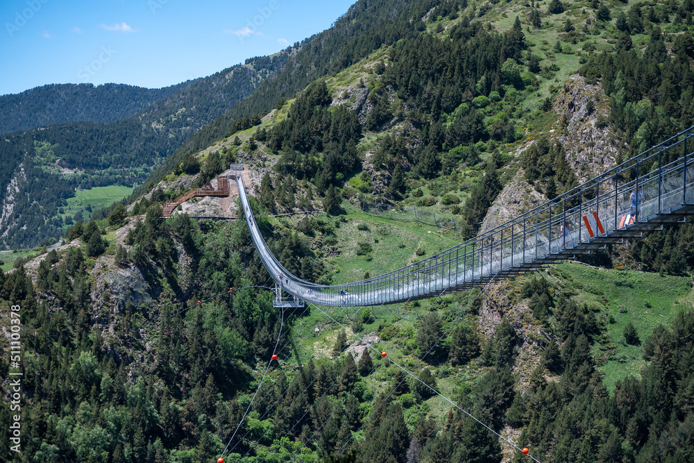 Obraz na płótnie People walking on the longest Tibetan bridge in Europe, 600 meters long and 200 meters high in the Parish of Canillo in Andorra. w salonie