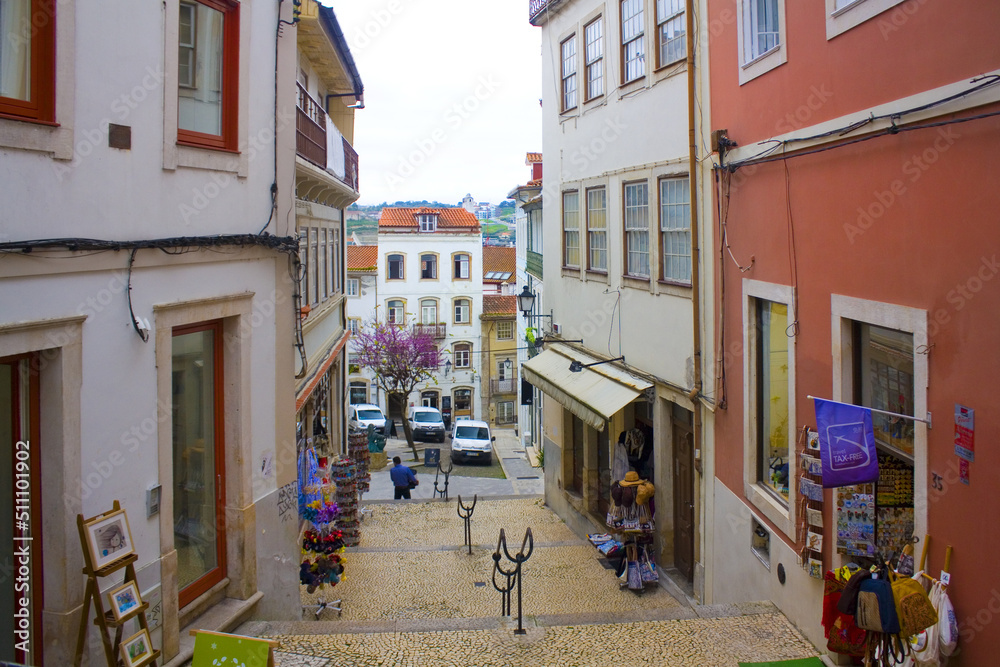 Picturesque street with ancient houses in Old Upper Town of Coimbra, Portugal	
