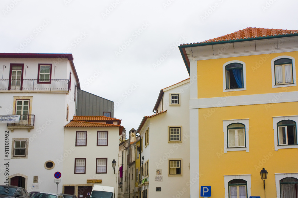 Picturesque street with ancient houses in Old Upper Town of Coimbra, Portugal