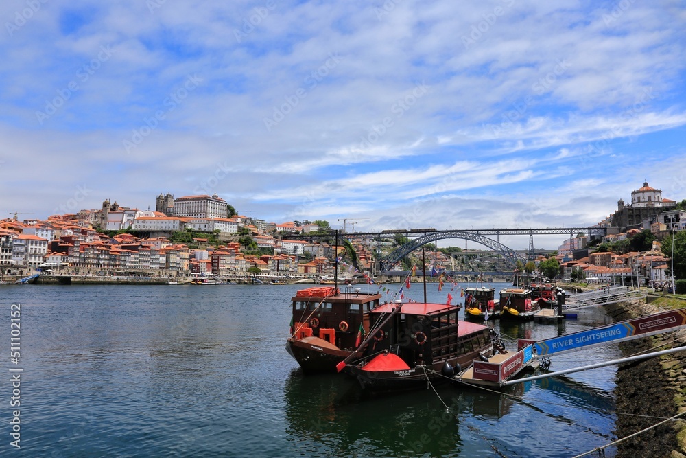 Historical Port Barges ‘Rabelo’ boats used to transport Port wine from the vineyards to Vila Nova de Gaia on the Douro river in Porto, Portugal