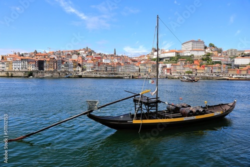 Historical Port Barges ‘Rabelo’ boats used to transport Port wine from the vineyards to Vila Nova de Gaia on the Douro river in Porto, Portugal