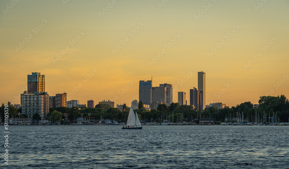 Skyline of Rotterdam by sunset with lake Kralingen in the foreground