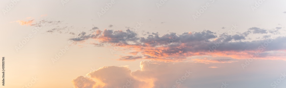 Large pink cloud at sunset in spring.