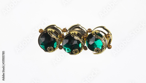 women jewelry bracelet with green stones on a white background