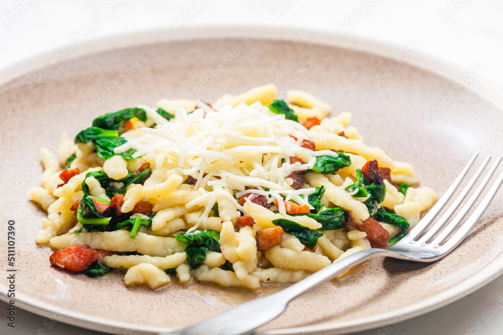 spetzle with spincha leaves, smoked bacon and grated cheese spetzle with spincha leaves, smoked bacon and grated cheese