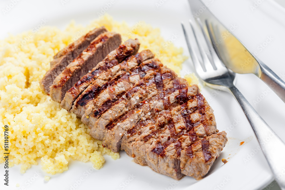 beef steak served with couscous