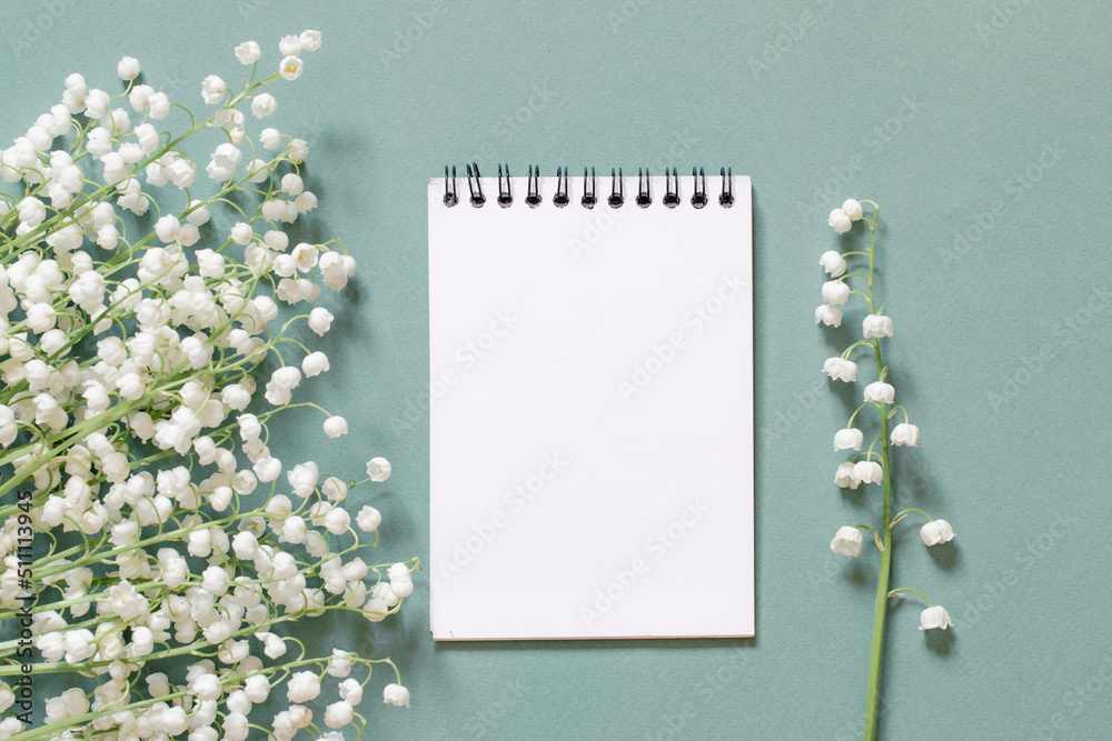 flowers and a blank sheet for writing what to do list or thanks. gratitude or planning concept flowers and a blank sheet for writing what to do list or thanks. gratitude or planning concept