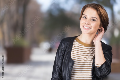 Happy young woman looking at the camera with a smile