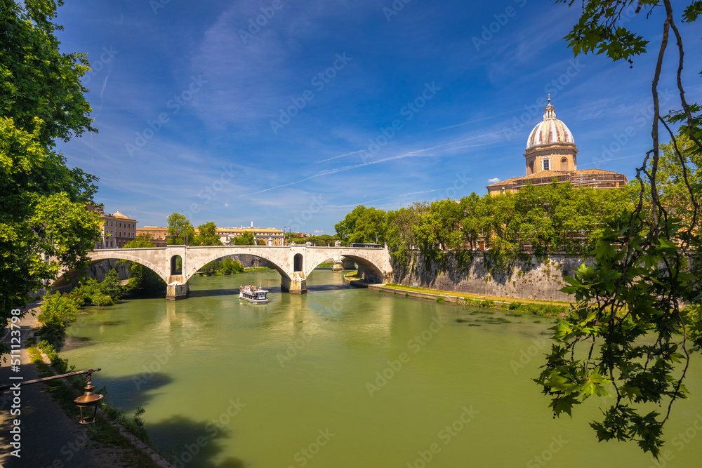 Tiber river with ancient bridge in Rome, Italy, Europe.