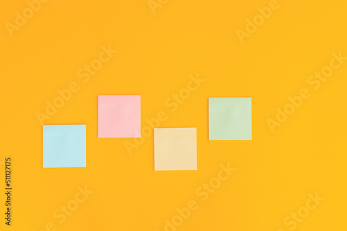 Colorful sticky notes on yellow background.