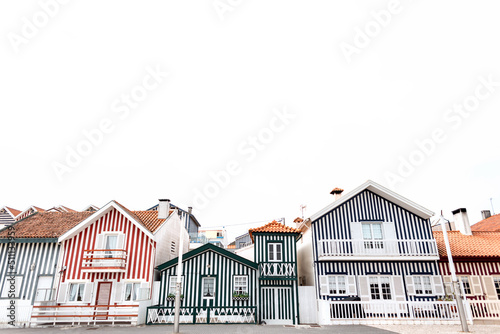 Vintage beautiful colored striped houses in a fishing resort town by the sea in Portugal