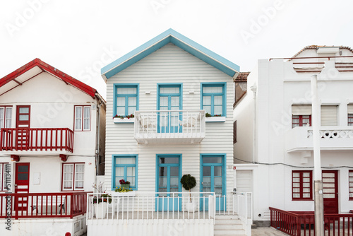 Vintage beautiful colored striped houses in a fishing resort town by the sea in Portugal