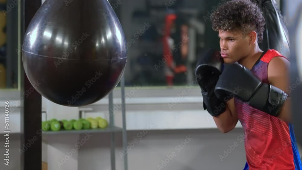 preparing for professional boxing competition, black guy is training hand punch