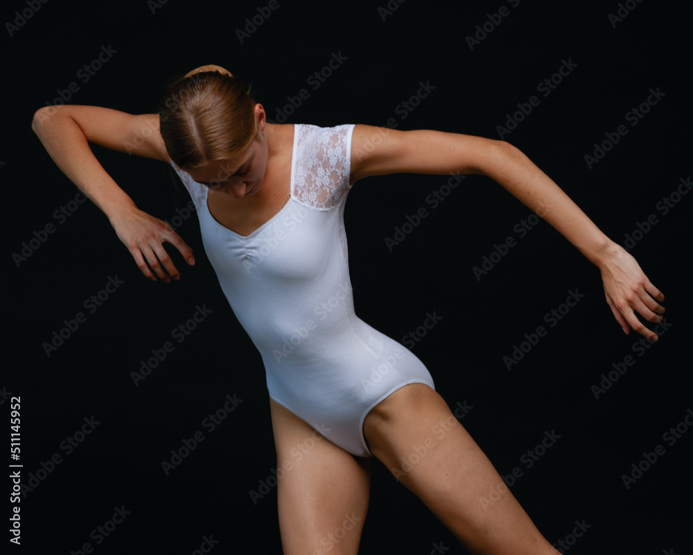 Young beautiful ballerina is posing in studio Young beautiful ballerina is posing in studio
