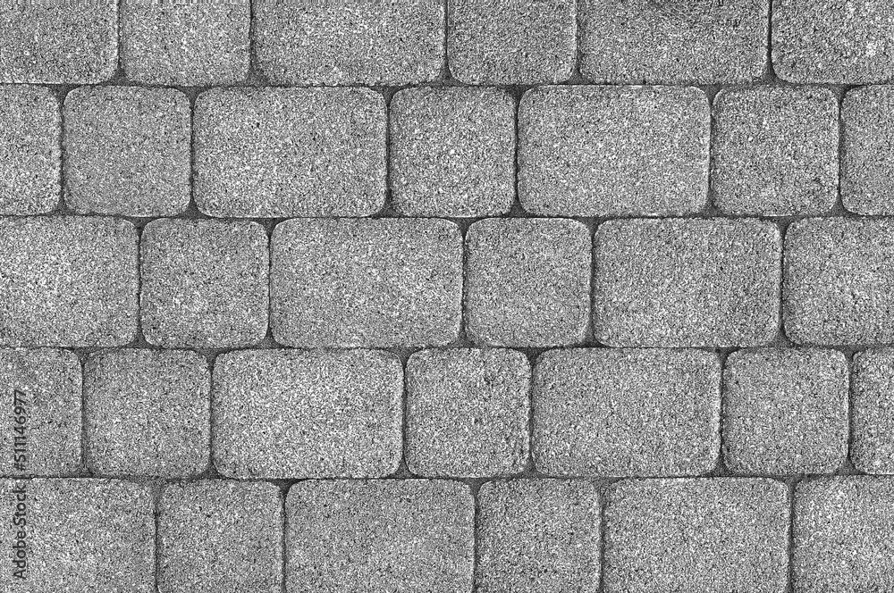 Floor is made of gray bricks of rectangular and square shape. Textured brick background. Floor is made of gray bricks of rectangular and square shape. Textured brick background.