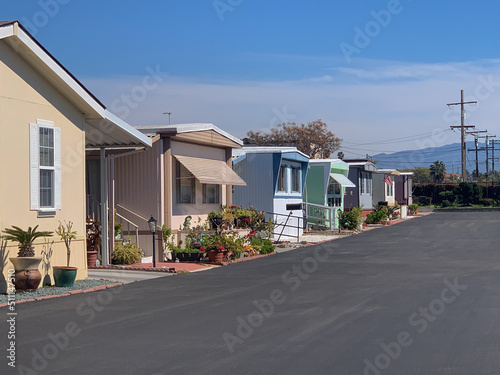 View of row of mobile homes in trailer park.